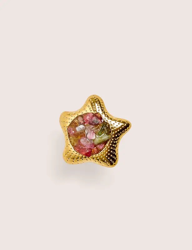 Anillo ajustable con estrella y detalle de piedra
