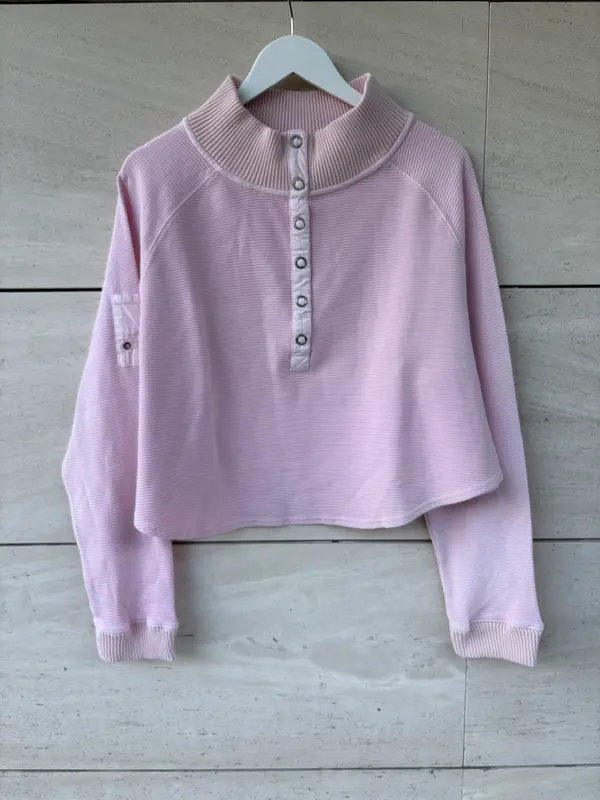 FREE PEOPLE MOVEMENT. Sudadera rosa claro textura
