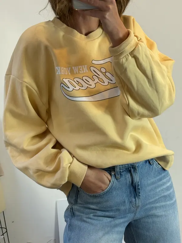 GINATRICOT. Sudadera pastel letras