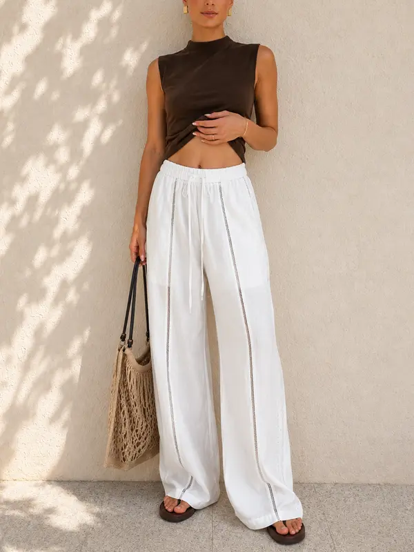 Pantalón ancho de tiro medio con cintura ajustable y calados