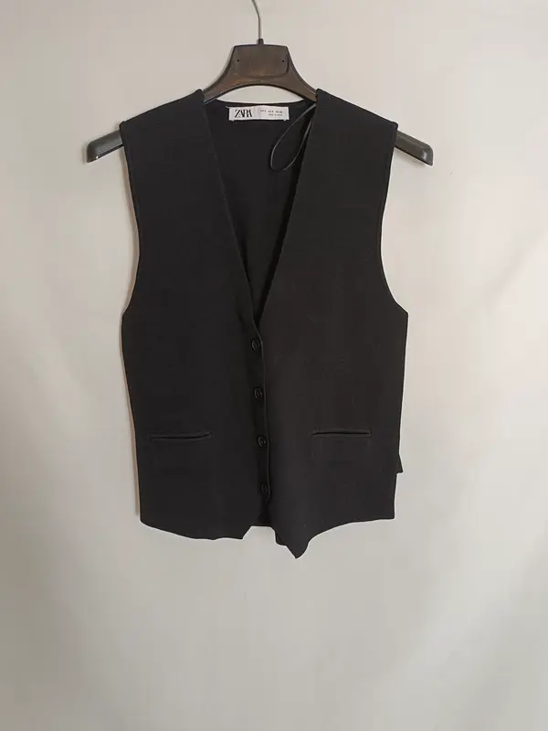 ZARA. Chaleco negro punto T.s